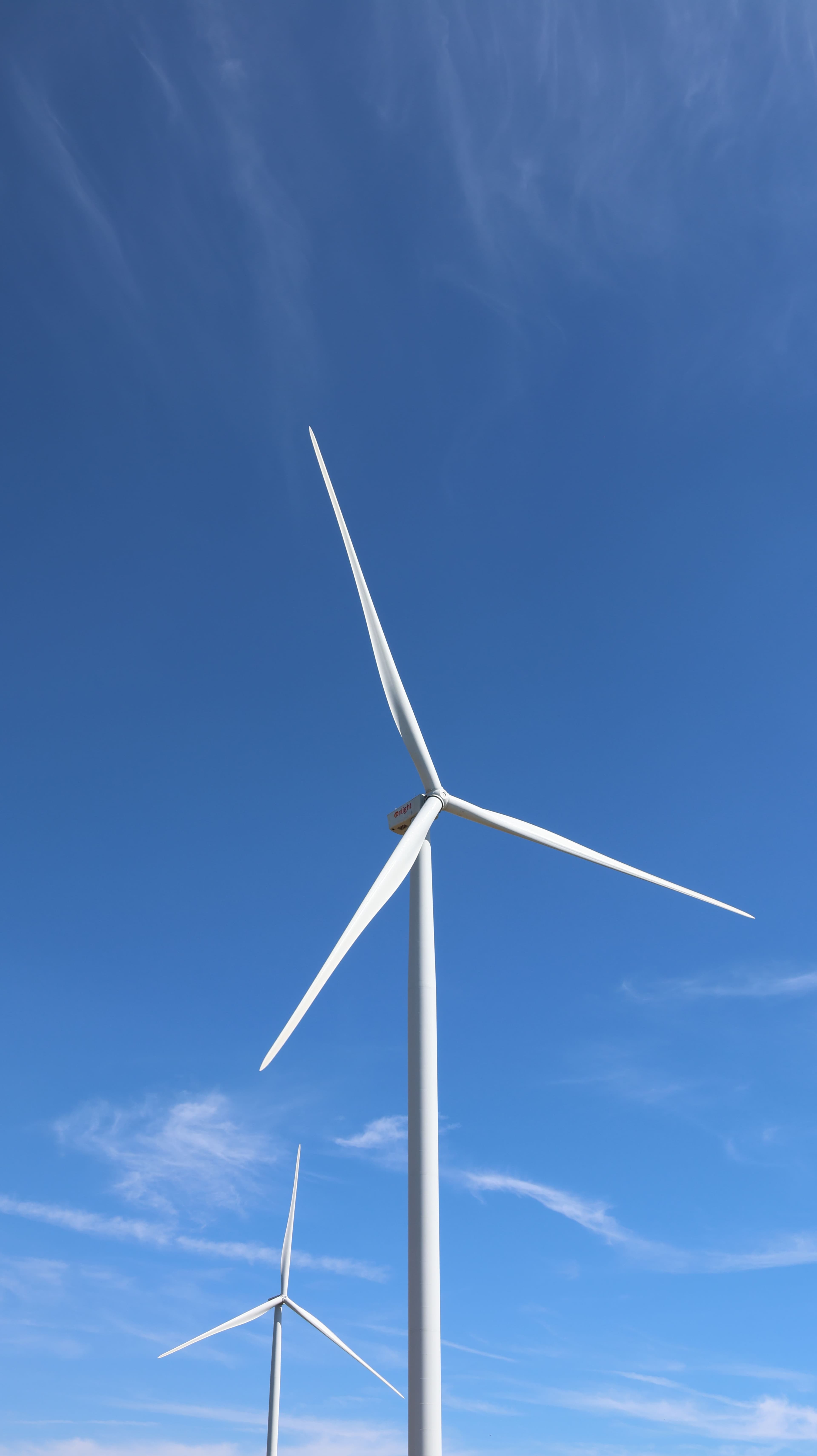 Wind turbines against a clear sky